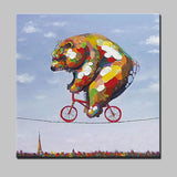tableau ours coloré sur un vélo