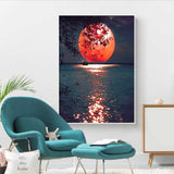 tableau lune rouge sur la mer