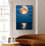 tableau lune orange et mer calme