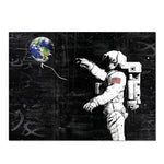 tableau astronaute et terre graffiti