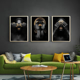 tableau femme noir visage en or