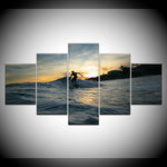 Tableau d’un surfer avec un coucher de soleil