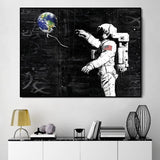 tableau astronaute et terre graffiti