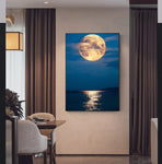 tableau lune orange et mer calme