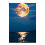 tableau lune orange et mer calme