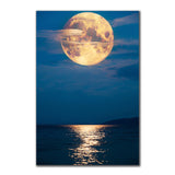 tableau lune orange et mer calme